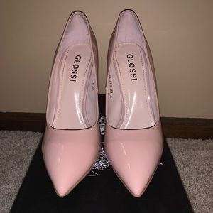Nude Patent leather pumps.